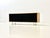 This elegant sideboard from knoll international impresses with its clean lines and high-quality craftsmanship. made of...