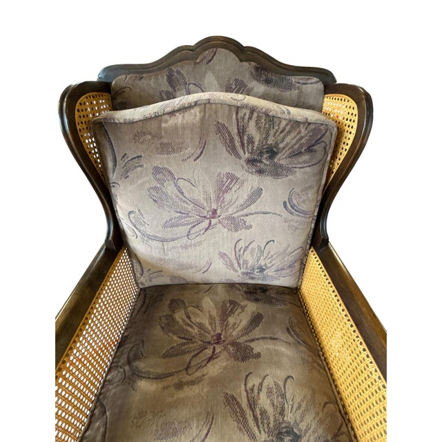 This handsome traditional lounge chair combines timeless craftsmanship with inviting comfort. Crafted with a rich dark...