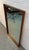 Enhance your space with the timeless appeal of this vintage Mid-Century Modern walnut-framed wall mirror. Featuring a...