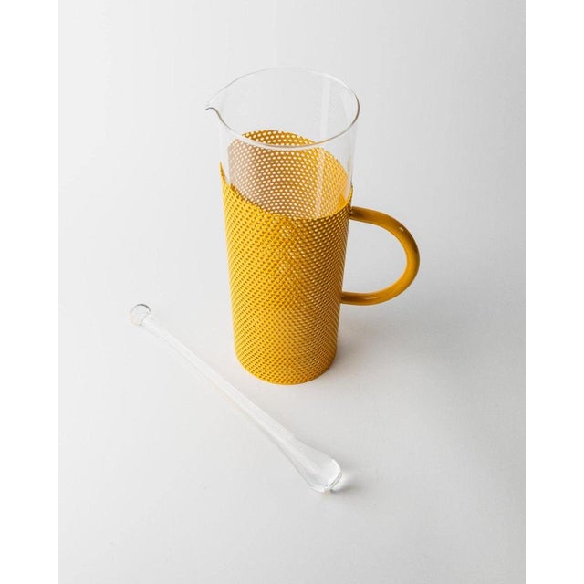 This vintage glass pitcher, designed by De Agostini in the 1980s, combines colorful design with practicality. The...