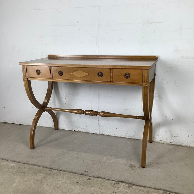 Timeless elegance meets everyday versatility in this beautifully proportioned vintage Regency-style console table, a...