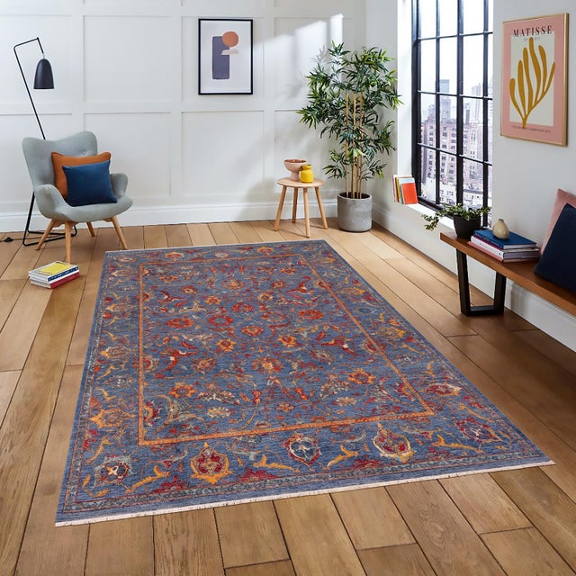 "Enhance the ambiance of your home with this magnificent Persian-influenced Turkish hand-knotted rug made by skilled...