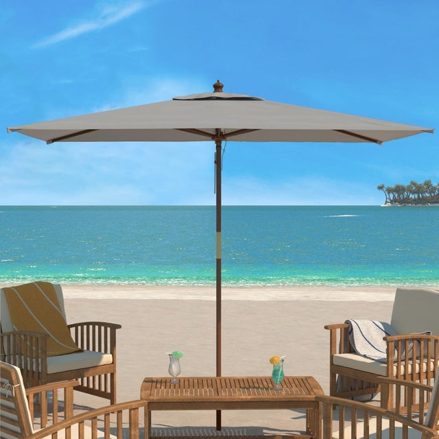 Create a stylish and shady retreat for any outdoor space with our Aklin market umbrella. Featuring a wide rectangular...