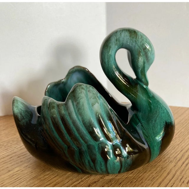 Add a touch of Mid-Century charm to your décor with this beautiful **Vintage Blue Mountain Pottery Swan Planter**....