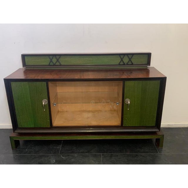Exceptional bar sideboard with stand. Art deco style with rationalist lines. Body in rosewood veneer on the front. Flared...