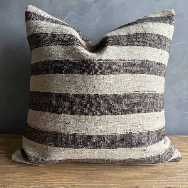 Creamy hemp rug pillow with stripes. Soft hand, linen blend backing with zipper closure. Spot cleaning is recommended, or...