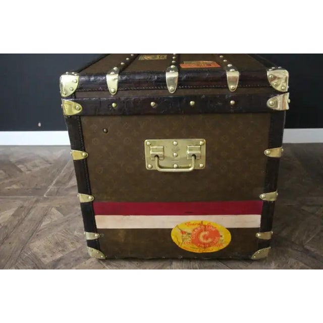 This superb Louis Vuitton steamer trunk features stenciled monogram canvas, deep chocolate color leather trim, LV stamped...