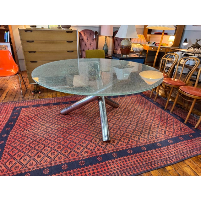 Striking vintage MCM chrome and glass table inspired by Milo Baughman's "Jax" table. Features a circular glass top and...