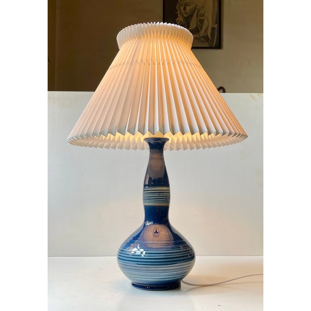 Antique gourd shaped table lamp from the studio of herman august kähler. Hypnotizing spiralling glaze in blue and white....