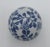 Delicate and timeless, this hand-painted blue and white porcelain sphere features a continuous floral vine motif rendered...