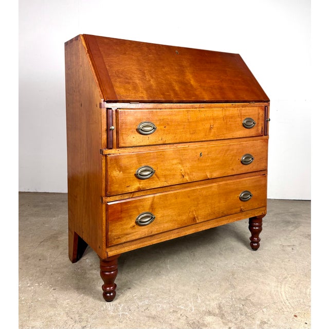 A beautiful antique secretary desk in Early American / New England style circa early 1800’s. Features cherry wood as...