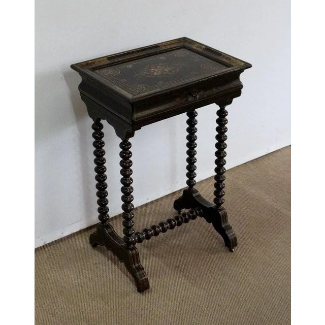 Small Napoleon III period book table in lacquered wood, presenting on its top called " à cuvette " motifs of flowers, net...