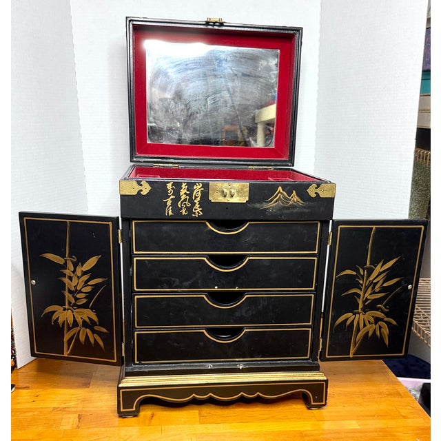 Vintage Large Lacquered Asian Jewelry Chest. Behind the Swing Doors are Four Felt lined Drawers. Large Mirror under Top...