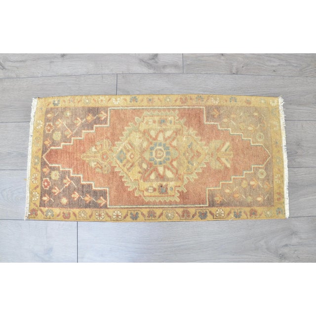 This is a vintage Turkish Oushak rug from the 1960s. The piece was hand-knotted.