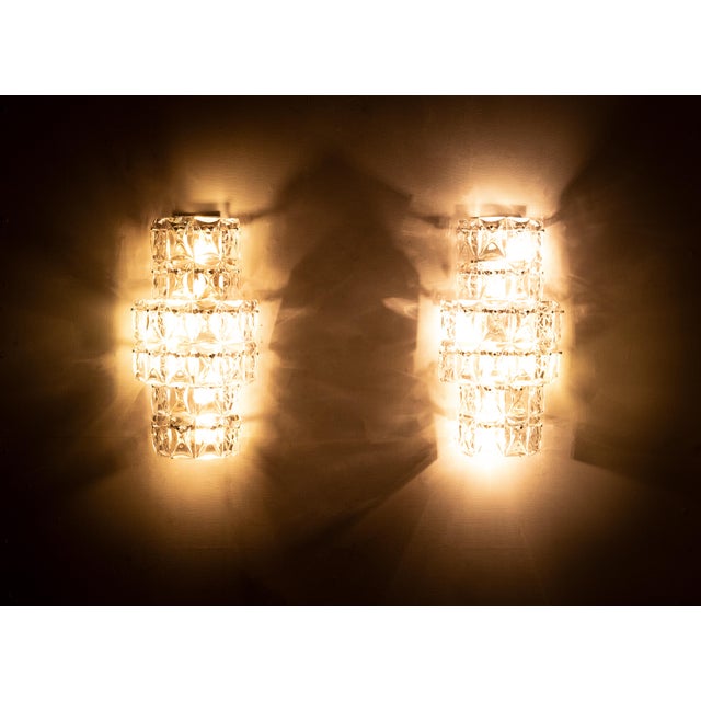 A beautiful set of Kinkeldey wall lamps with cut crystals per fixture. 8 x E27 fittings per fixture. Chrome fixture in...