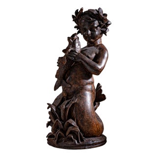 Sculpture of a Putti as Aquarius, Early 20th Century, Cast Iron For Sale