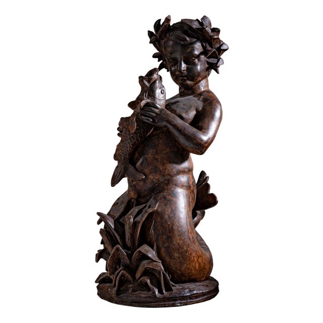 Sculpture of a Putti as Aquarius, Early 20th Century, Cast Iron For Sale