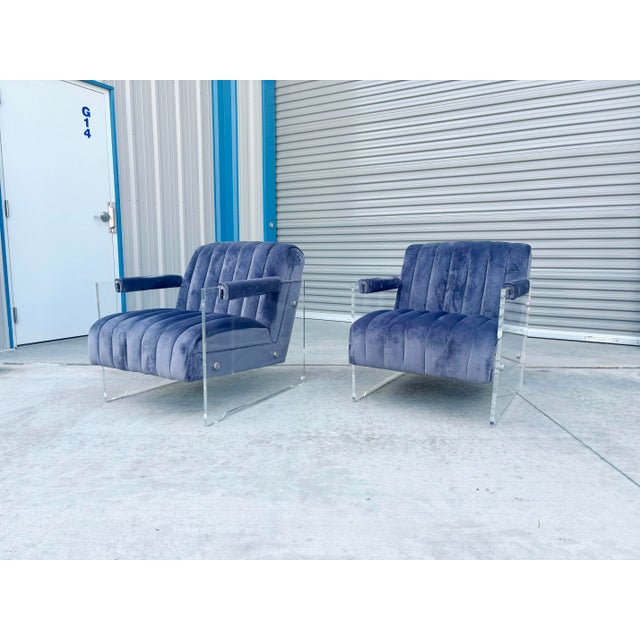 ✨ Mid-Century Modern Lucite Lounge Chairs ✨ This striking pair of Mid-Century Modern lounge chairs masterfully blends bold...