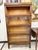 A handsome antique Macey four-stack barrister bookcase in richly grained oak, featuring four individual glass-front...