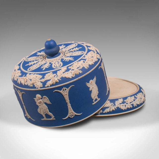 This is an antique decorative cheese keeper. An English, Jasperware serving dome in the manner of Wedgwood, dating to the...