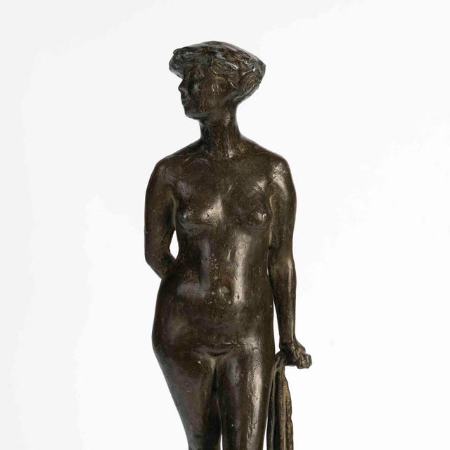 Patinated bronze sculpture on a stone base, Art Deco period, circa 1930. Art Deco period sculpture, 1930 in patinated...