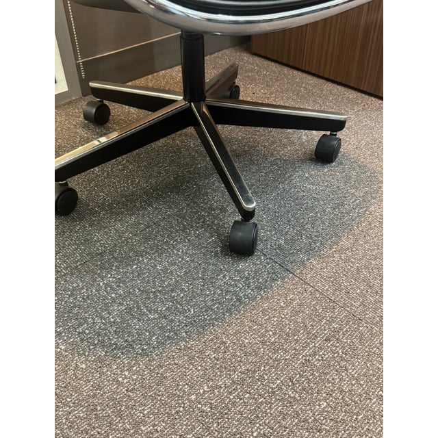 Set of 4 Pollock Executive Chairs in black leather. Designed by Charles Pollock for Knoll in 1963, the Pollock Executive...