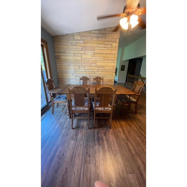 Solid oak Jacobean refractory table. 5 chairs + Captains chair. Circa 1880’s. 60 in long, 38” wide. Two 13” extensions...