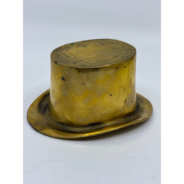 Vintage novelty top hat statue made of solid brass. A unique piece to add to your decor.