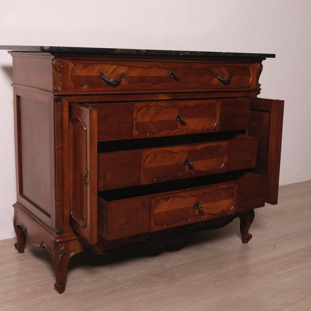 Beautiful and elegant chest of drawers with a marble top, two side doors that open to reveal the drawers. Dimensions:...