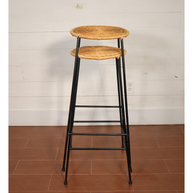 Price is for the pair. Pair of Arthur Umanoff Raymor style wrought iron and wicker stacking bar stools. They are in good...