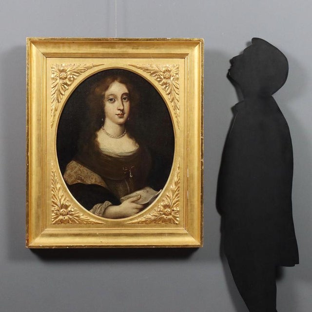 Oil on canvas. Northern European School. A young woman wishes to signal her passion, or perhaps her commitment, to the...