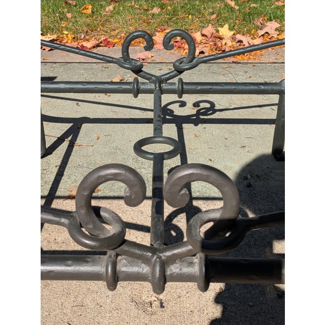 This is an unsigned Paul Ferrante "Emilio" coffee table. This table features a heavy iron base with a hand forged or...