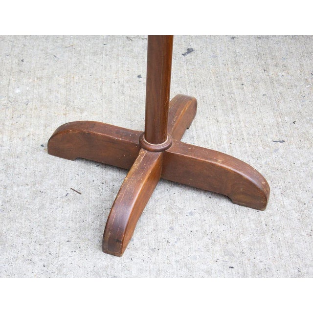USA, 1940s Wooden coat rack stand with a chunky X base and sculpted 'hooks'. Great look to this piece in rich solid...