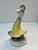 A charming vintage handpainted Hungarian porcelain sculpture depicting a folk dancing girl in a traditional Hungarian...