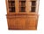 Louis Philippe fruitwood cabinet featuring a sleek glass top. Adorned with window-pane style doors at the top, this...