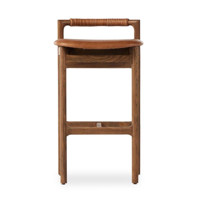 With a low back and minimalist frame, a top-grain leather seat plus leather wrap detailing add design-forward details to...