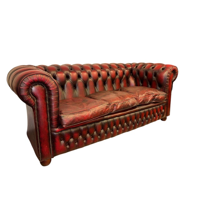 Genuine three seat sofa with deep button tufting. Traditional Chesterfield with rolled arms and studded detailing. NOTE!...