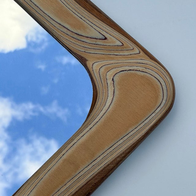 This large Robert Hargrave wall mirror is a great example of sculptural American studio design from the period. The...