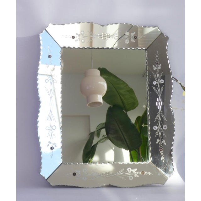 A Venetian rectangular wall mirror with etched glass. The stunning Italian mirror is made in the mid 20th century and has...