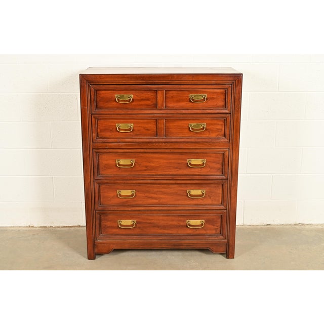 A gorgeous Mid-Century Modern Hollywood Regency Campaign style highboy dresser or chest of drawers By Thomasville,...