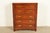 A gorgeous Mid-Century Modern Hollywood Regency Campaign style highboy dresser or chest of drawers By Thomasville,...