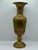 A striking vintage brass vase marked India on the bottom, featuring an elegant pedestal form, flared trumpet rim, and...