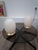 Beautiful pair of table lamps. Italy, 1970s. Brass base. Each lamp features a stunning egg-shaped tulip shade. Murano...