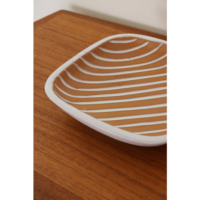 Large trinket tray by designer Ingrid Atterberg, manufactured by the Swedish company Upsala Ekeby AB. In excellent...