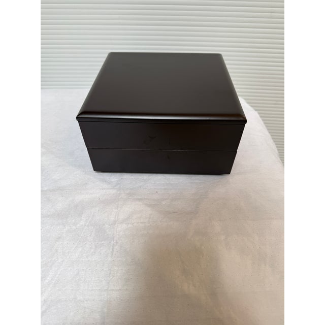 Design Plus Gallery presents a Layered Organizer or Origami Style Wooden Box. This box has a fully encased closure that...