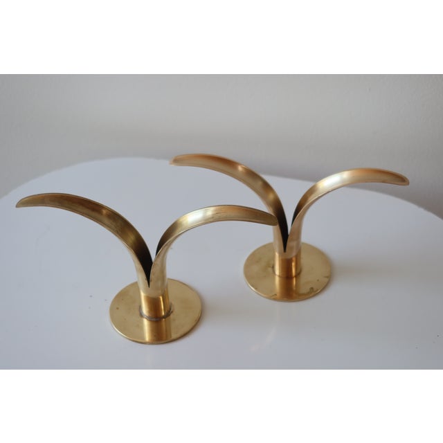 Pair of vintage Swedish brass "Liljan" (Lily) candleholders designed by Ivar Åhlenius Björk for Ystad Metall, Sweden....