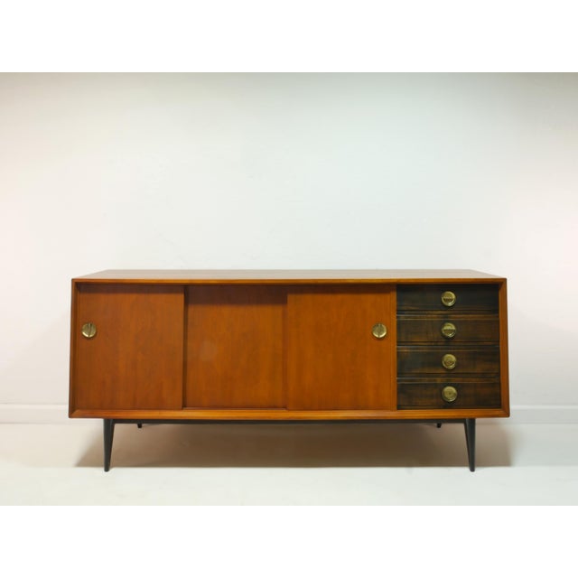 This exceptional sideboard from the 1960s is a high-quality, custom-made piece crafted by a cabinetmaker, not a mass-...