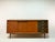 This exceptional sideboard from the 1960s is a high-quality, custom-made piece crafted by a cabinetmaker, not a mass-...