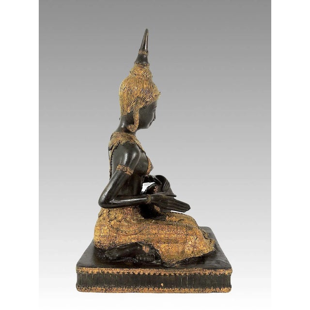 An early 20th. Century reproduction styled upon figures from the Thai Rattanakosin Kingdom 1782-1932. This seated female...