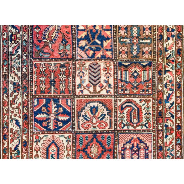 A mid-20th century Persian Bakhtiari rug with a wonderful patchwork quilt-like motif with multiple squares depicting...